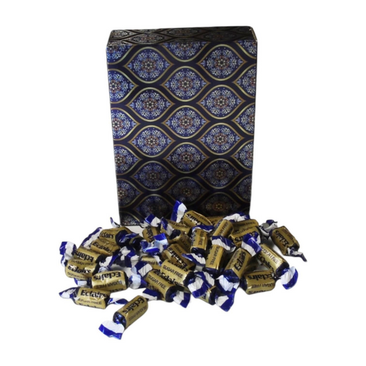 Pots of Sweets sugar-free chocolate eclairs in gold wrappers with blue ends, displayed with a decorative gift box.